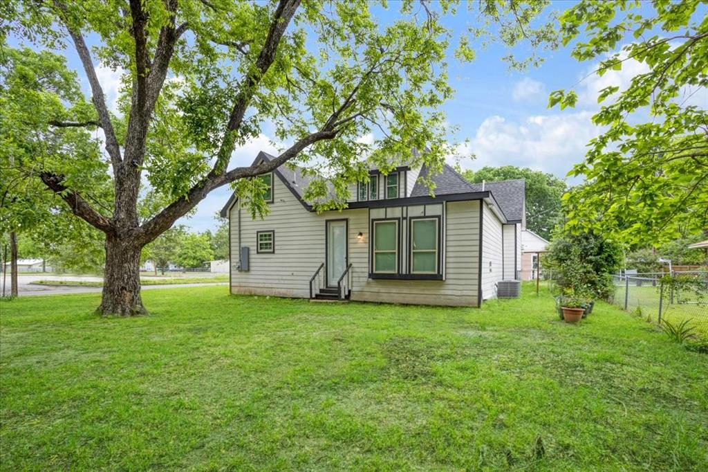 721 Maple Street Bonham, TX 75418 - Photo 27 of 30 a view of a house with a yard