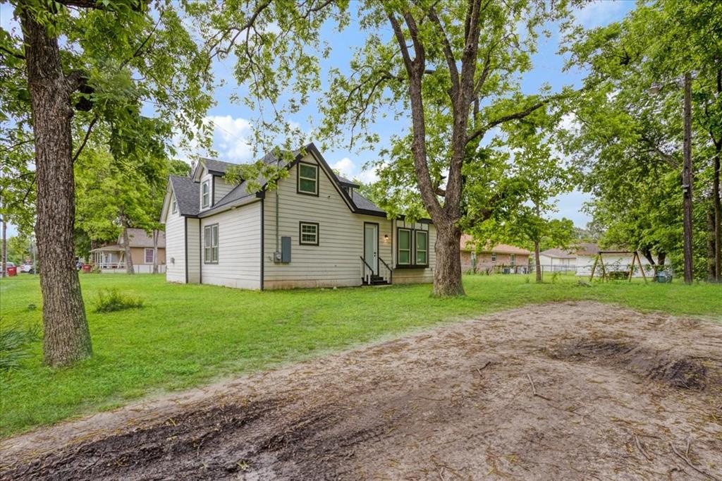 721 Maple Street Bonham, TX 75418 - Photo 29 of 30 a view of a house with yard and tree s