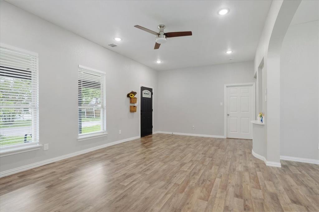 721 Maple Street Bonham, TX 75418 - Photo 4 of 30 a view of an empty room with a window