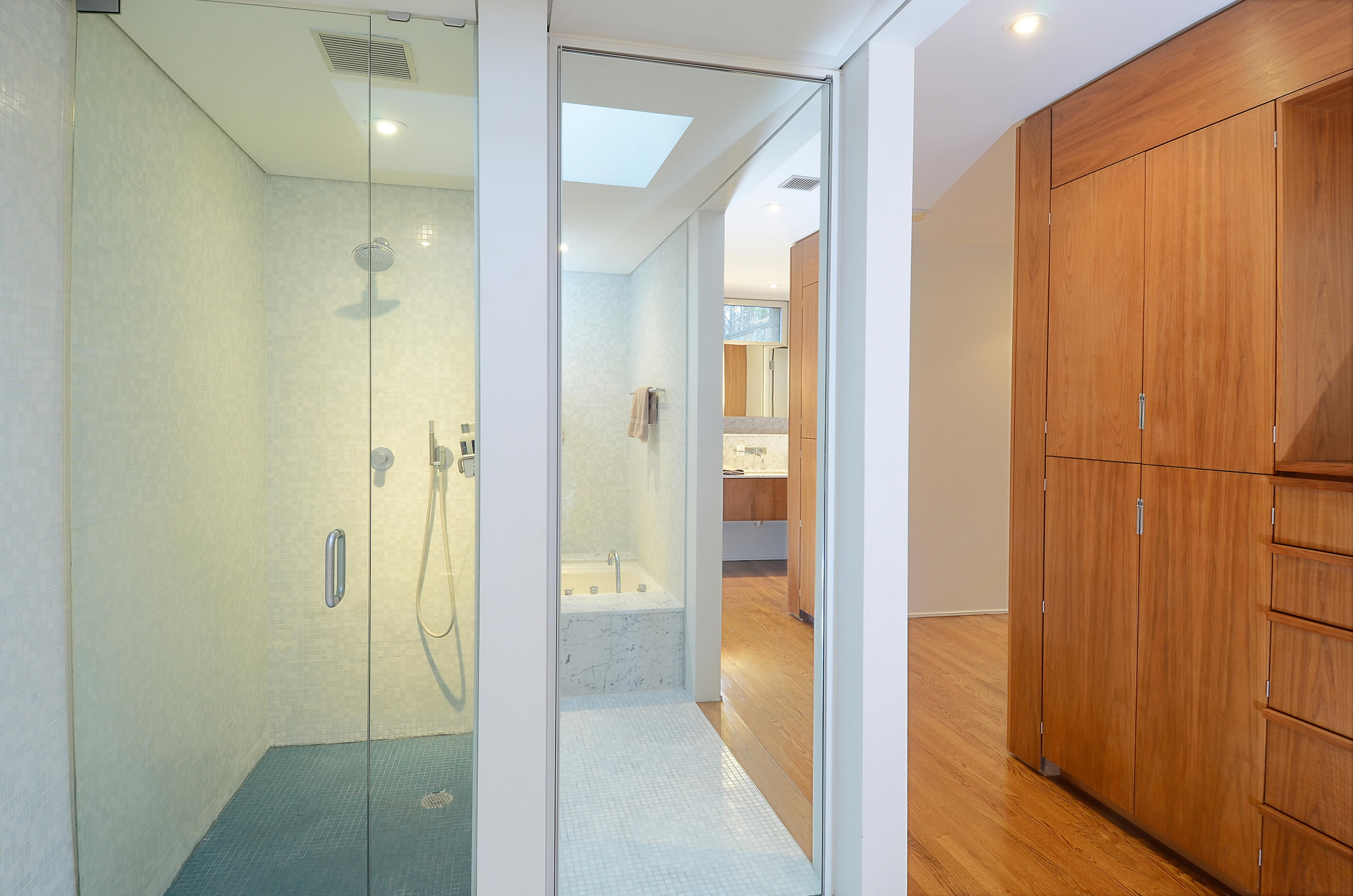 1380 Ponus Ridge Road New Canaan, CT 06840 - Photo 12 of 22 a view of a bathroom with a glass shower door