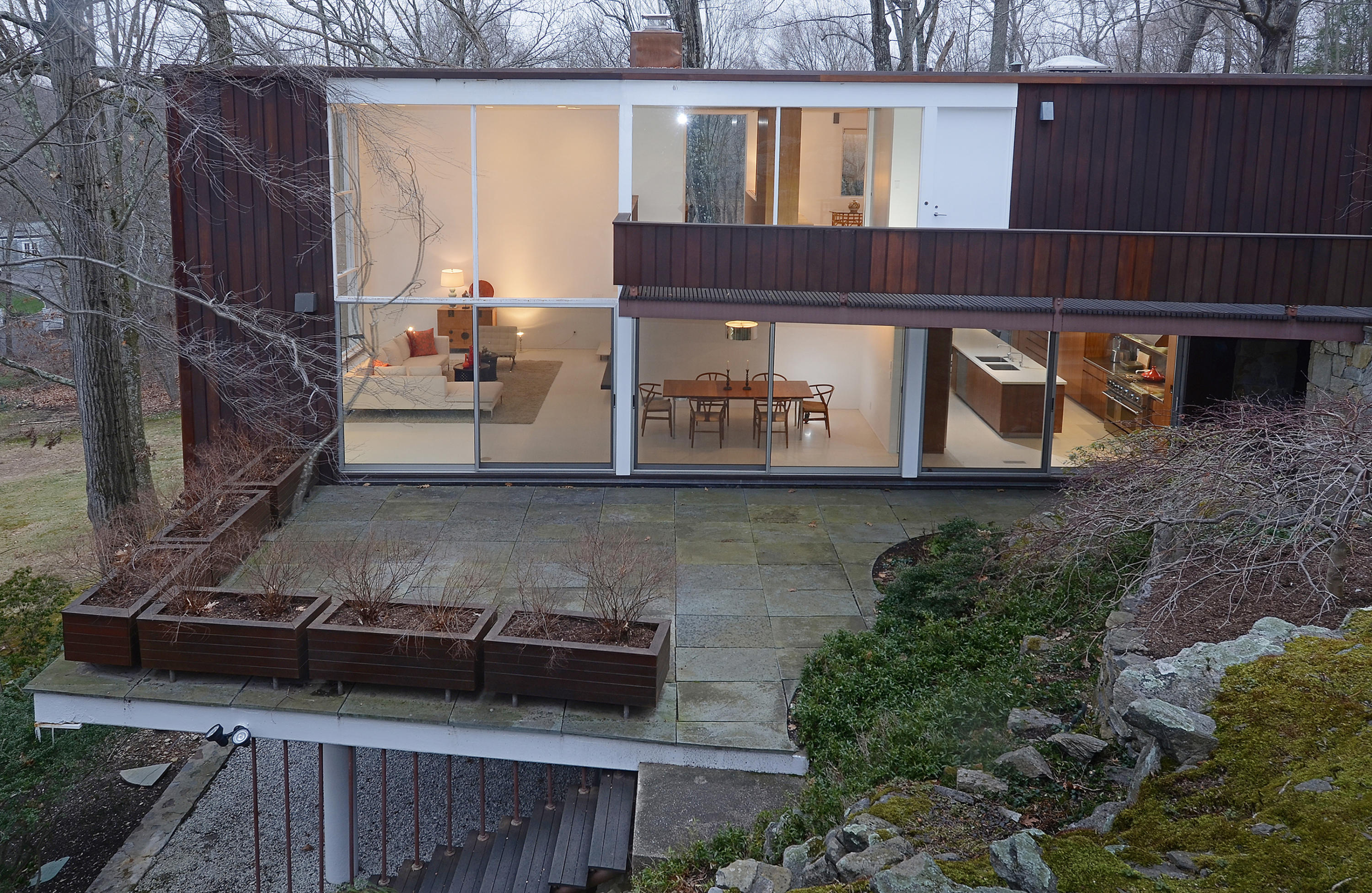 1380 Ponus Ridge Road New Canaan, CT 06840 - Photo 17 of 22 a view of a balcony with wooden floor and fence