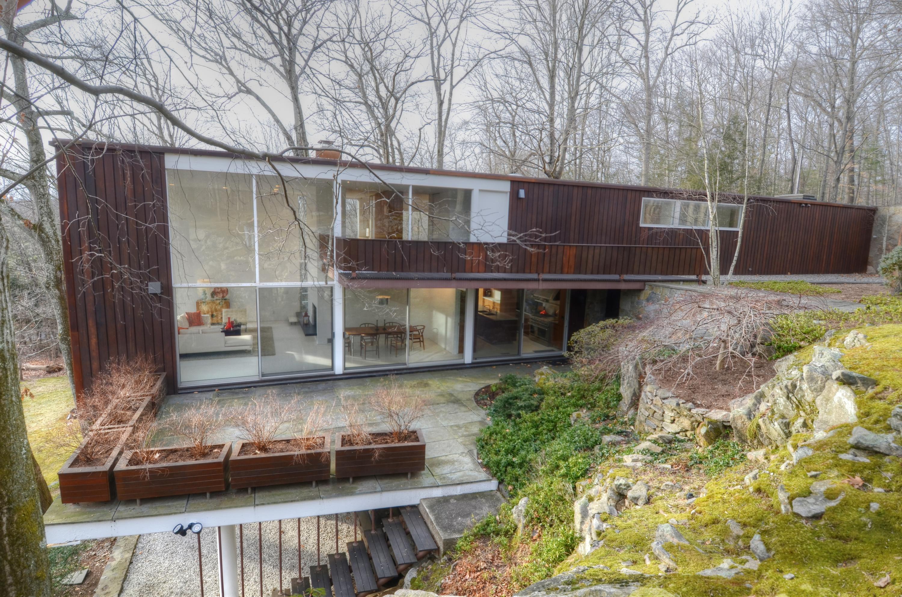 1380 Ponus Ridge Road New Canaan, CT 06840 - Photo 19 of 22 a view of a house with backyard and sitting area