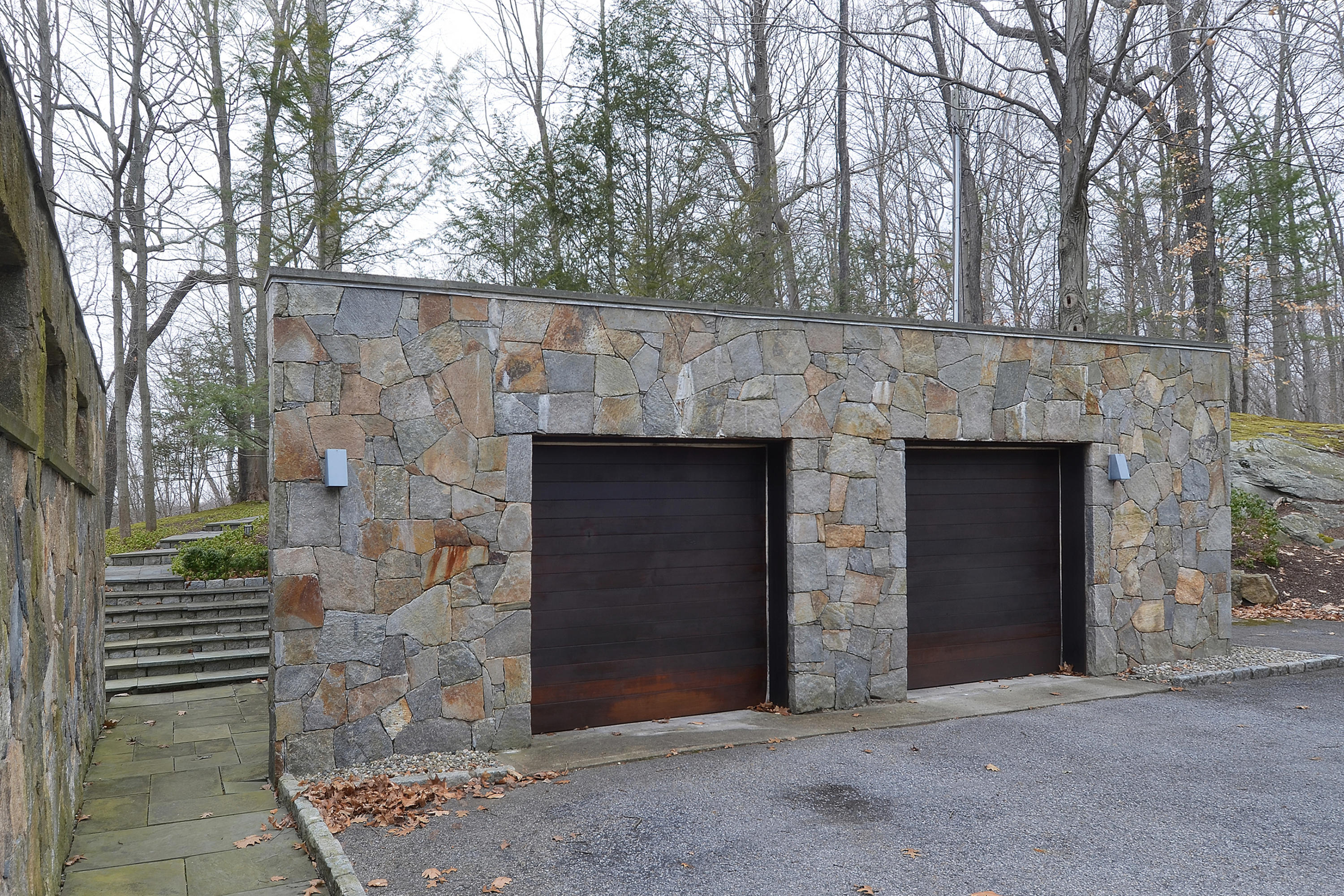 1380 Ponus Ridge Road New Canaan, CT 06840 - Photo 20 of 22 a front view of a house with yard