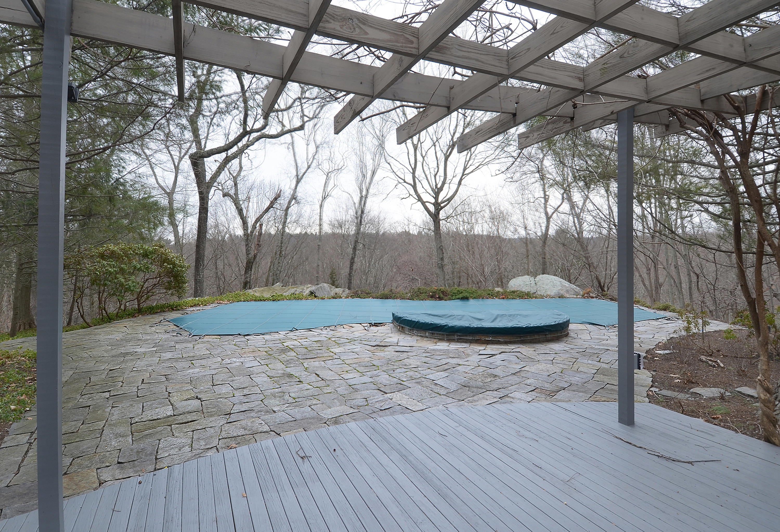 1380 Ponus Ridge Road New Canaan, CT 06840 - Photo 21 of 22 a view of a backyard with trees