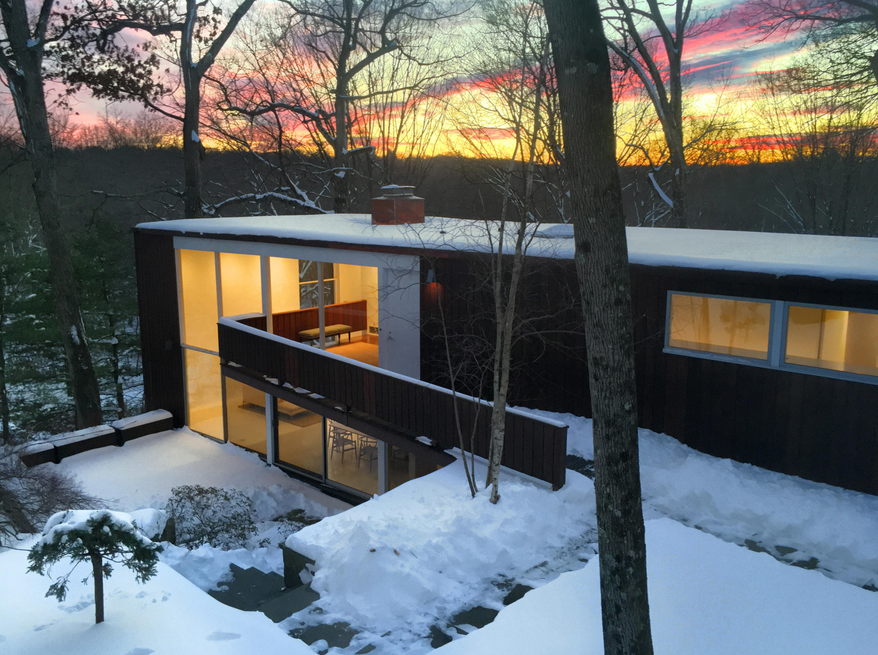 1380 Ponus Ridge Road New Canaan, CT 06840 - Photo 3 of 22 a backyard of a house with table and chairs