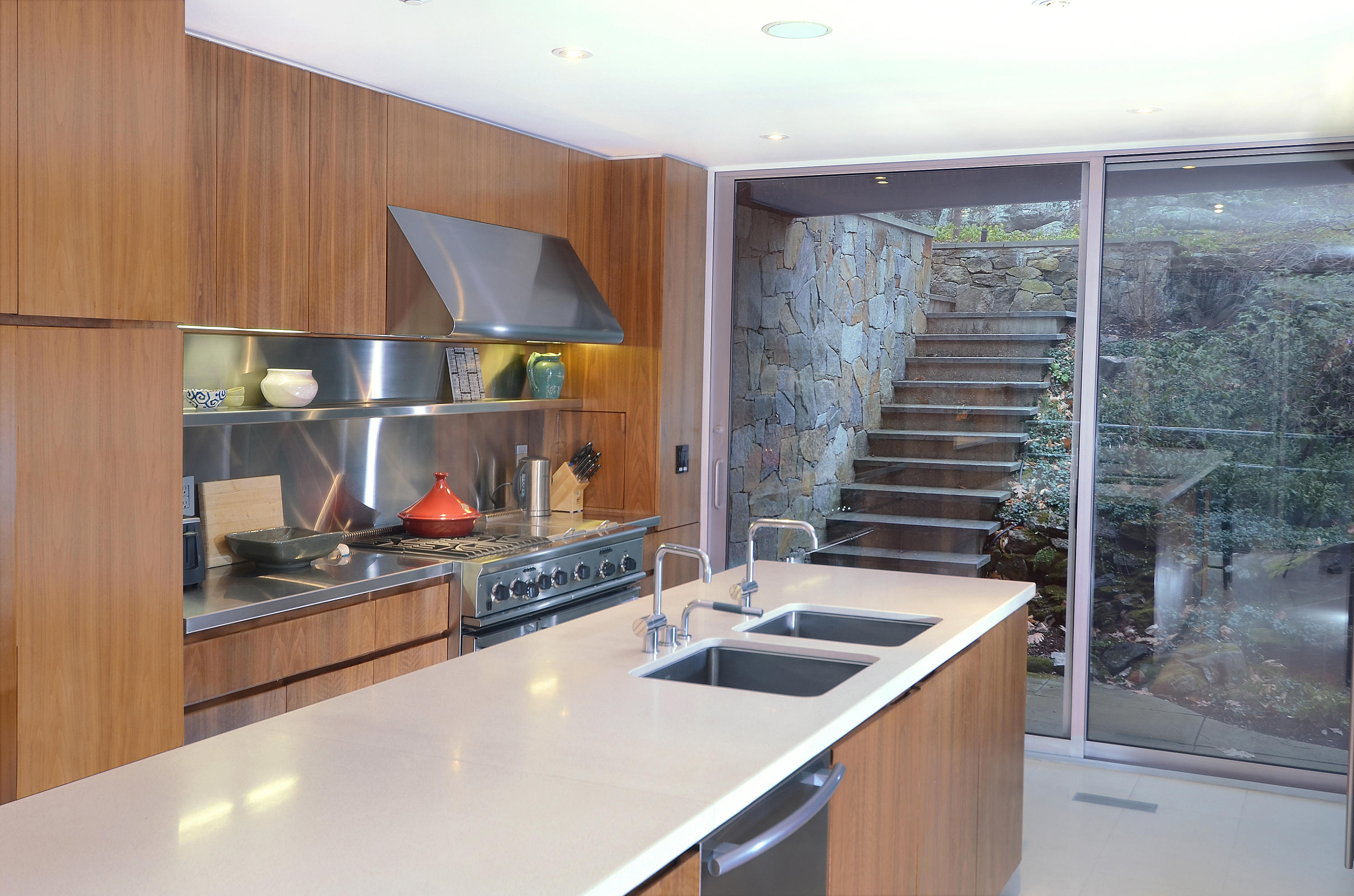 1380 Ponus Ridge Road New Canaan, CT 06840 - Photo 9 of 22 a kitchen with a sink and a refrigerator
