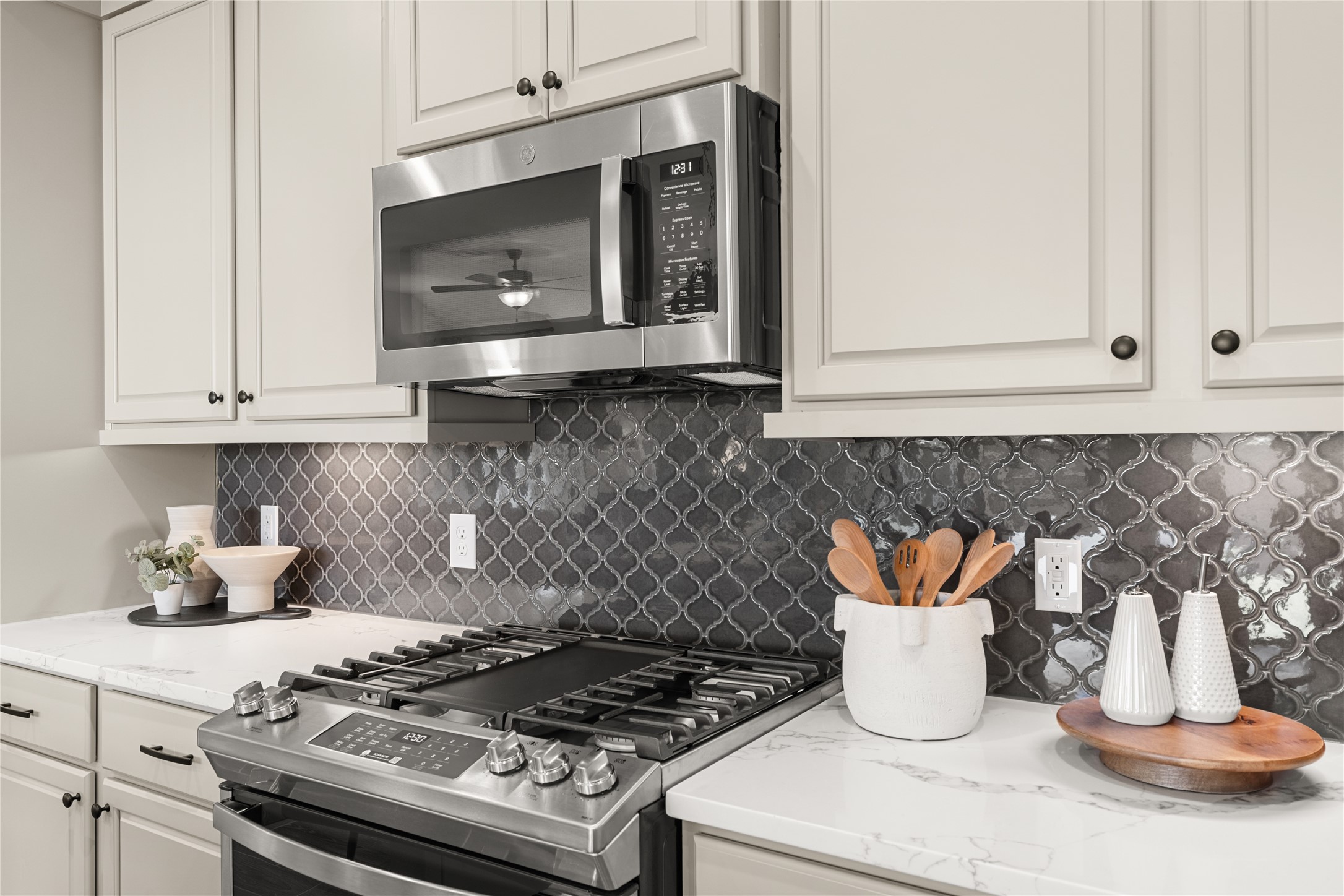5255 Celestial Court Iowa Colony, TX 77583 - Photo 16 of 29 a kitchen with granite countertop white cabinets and a stove