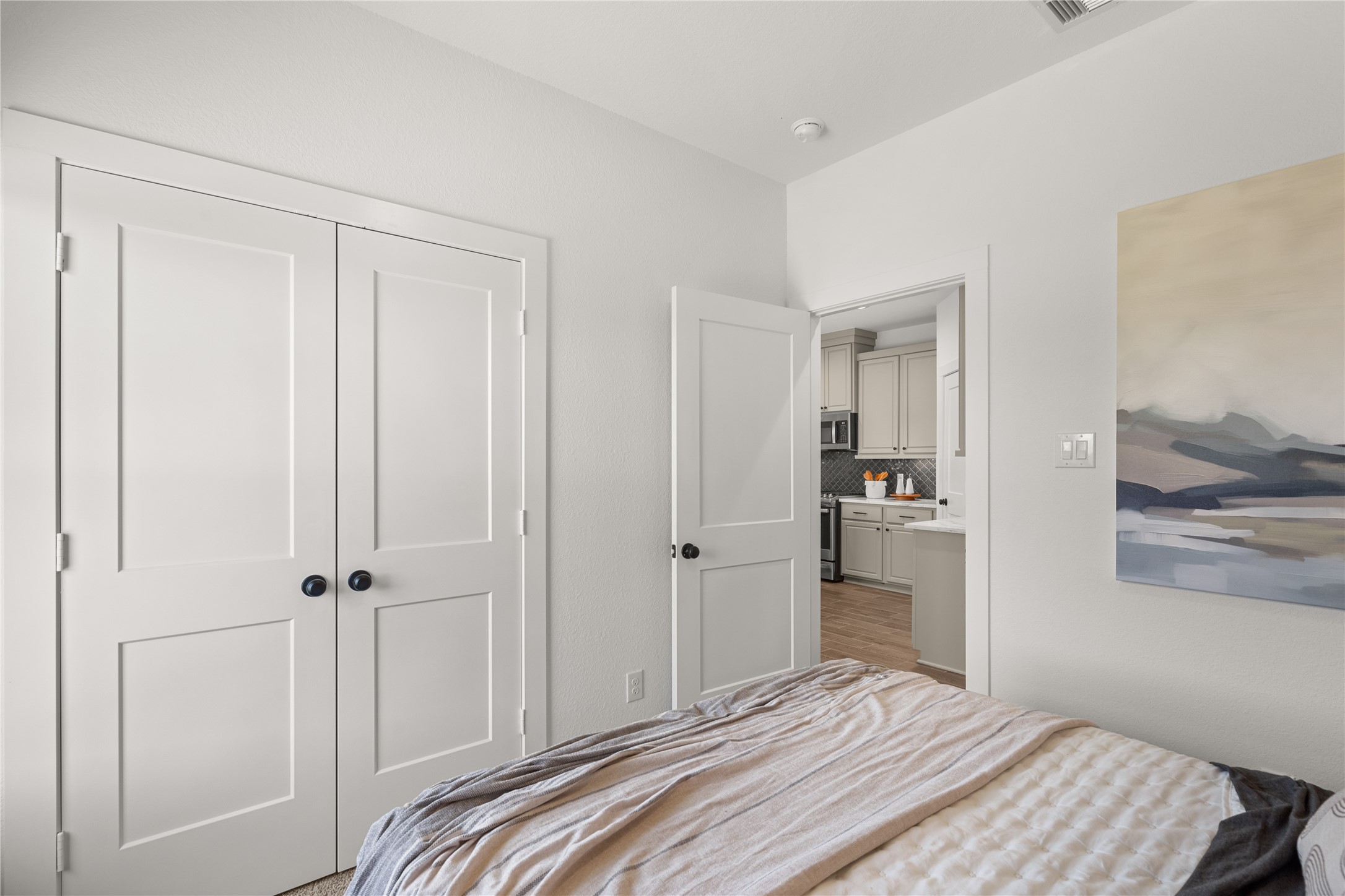 5255 Celestial Court Iowa Colony, TX 77583 - Photo 18 of 29 a bedroom with a bed and a view of bathroom