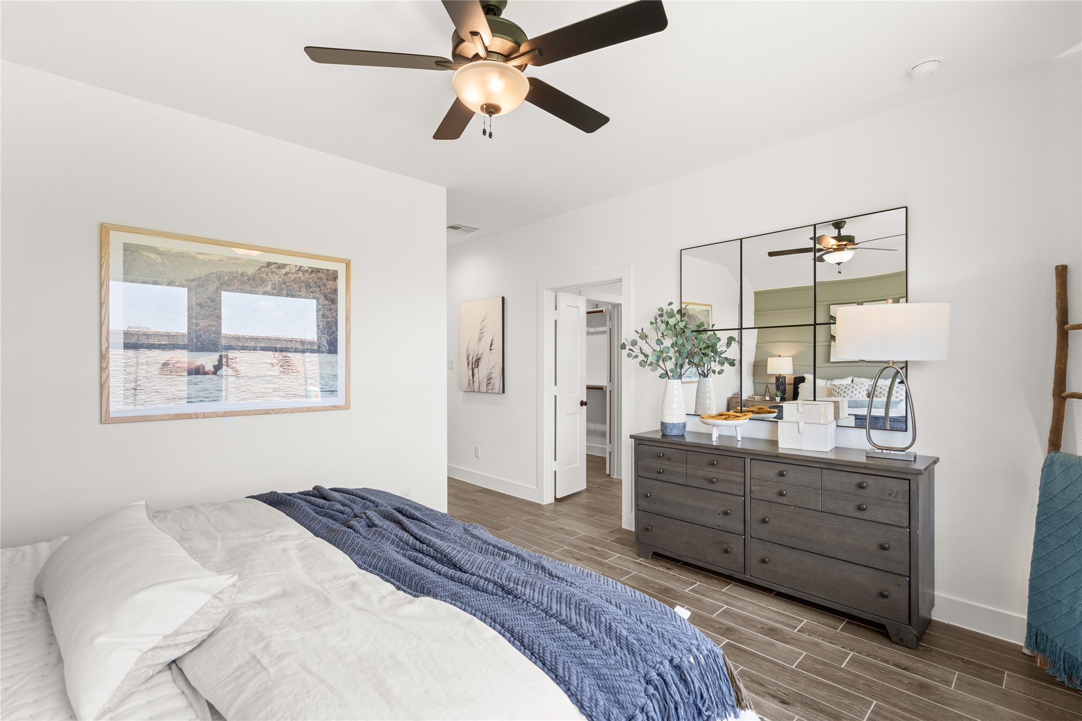 5255 Celestial Court Iowa Colony, TX 77583 - Photo 24 of 29 a bedroom with a bed and a dresser