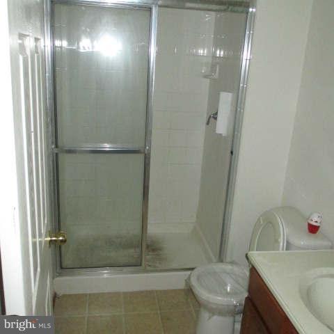 604 Moody Road Baltimore, MD 21220 - Photo 14 of 21 a bathroom with a sink and mirror