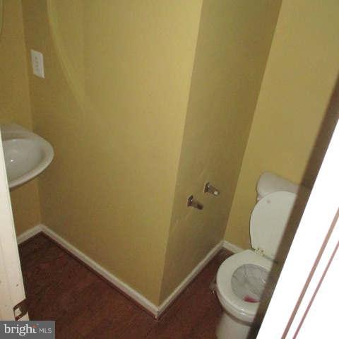 604 Moody Road Baltimore, MD 21220 - Photo 3 of 21 a bathroom with a sink and toilet
