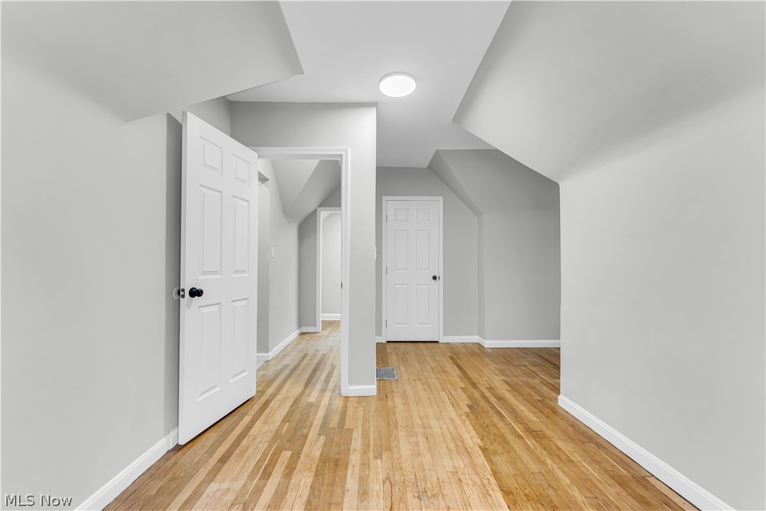 1000 Pennfield Road Cleveland, OH 44121 - Photo 24 of 34 Bonus room featuring lofted ceiling and light wood-type flooring