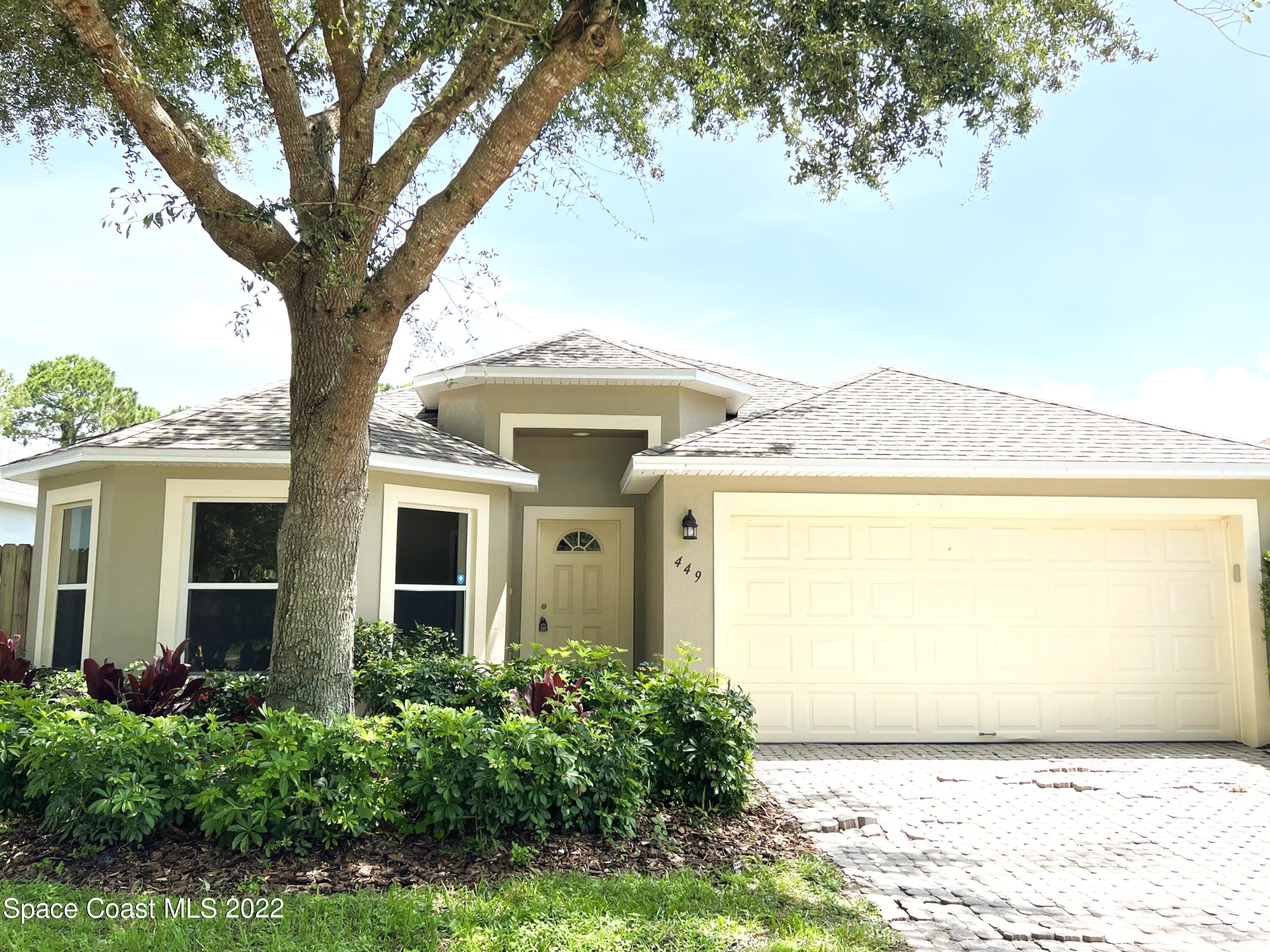 449 Alison Street Titusville, FL 32780 - Photo 1 of 18 front view of a house with a yard