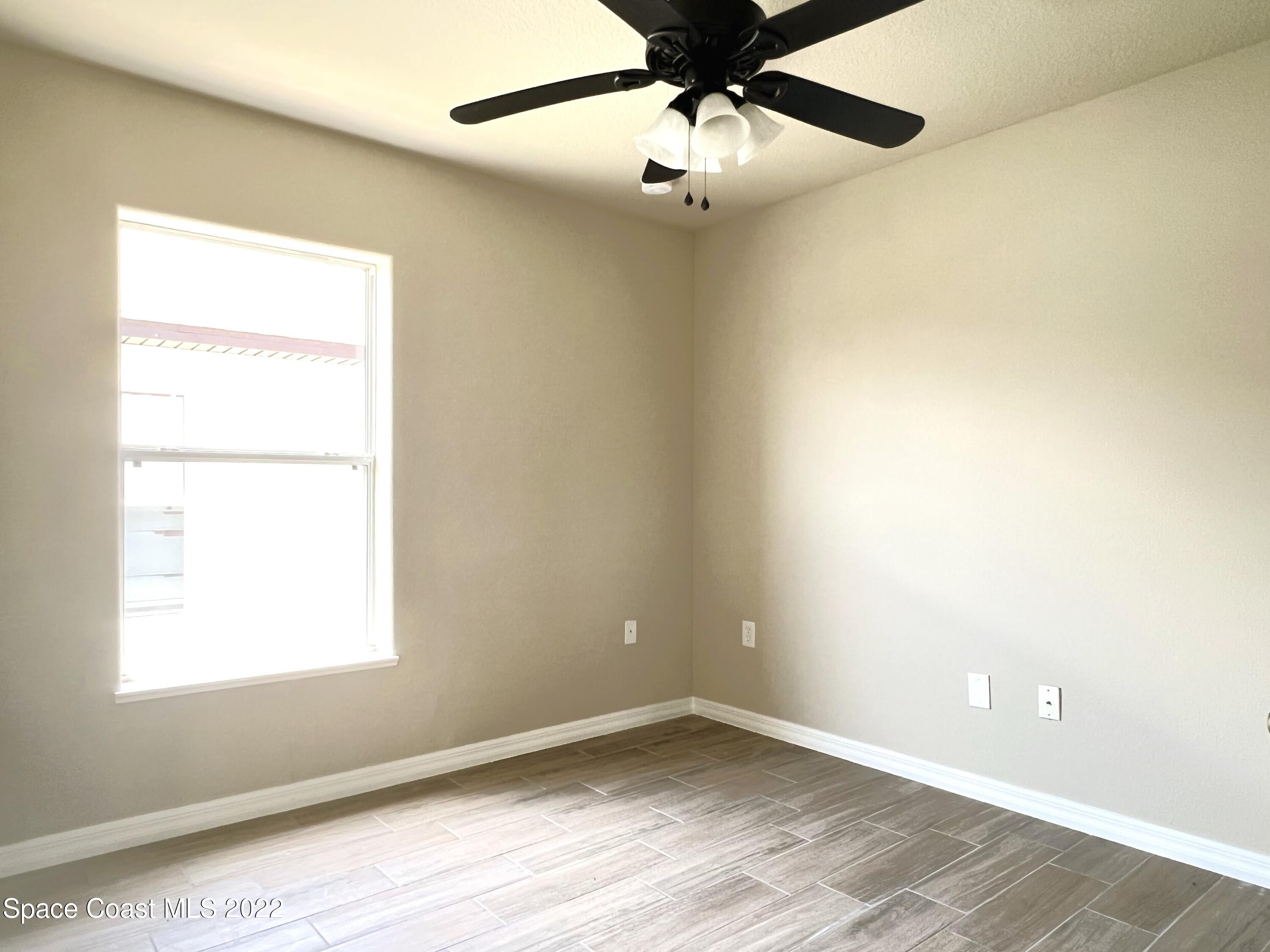 449 Alison Street Titusville, FL 32780 - Photo 16 of 18 an empty room with a window