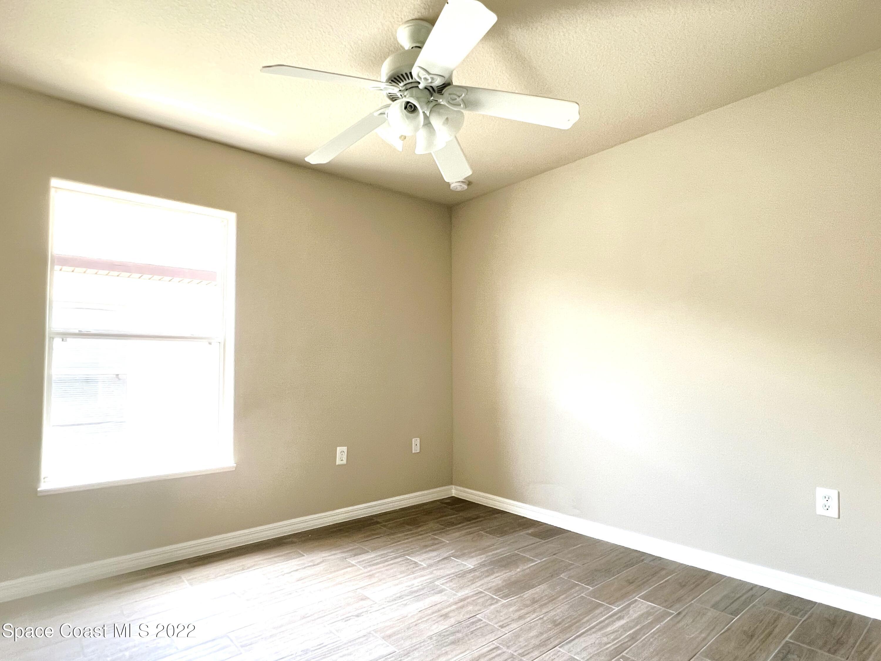 449 Alison Street Titusville, FL 32780 - Photo 17 of 18 an empty room with a window