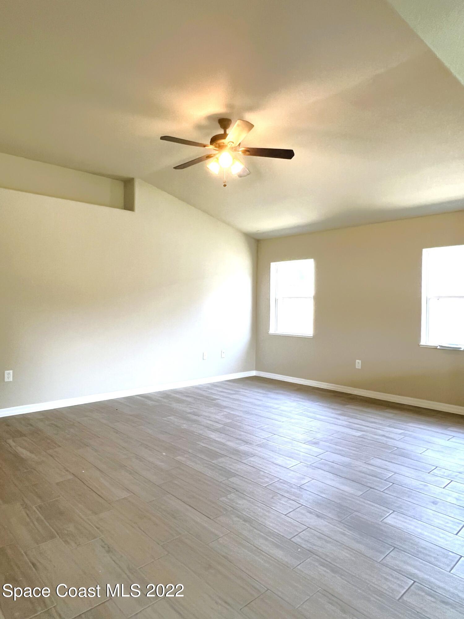 449 Alison Street Titusville, FL 32780 - Photo 7 of 18 a view of an empty room and window