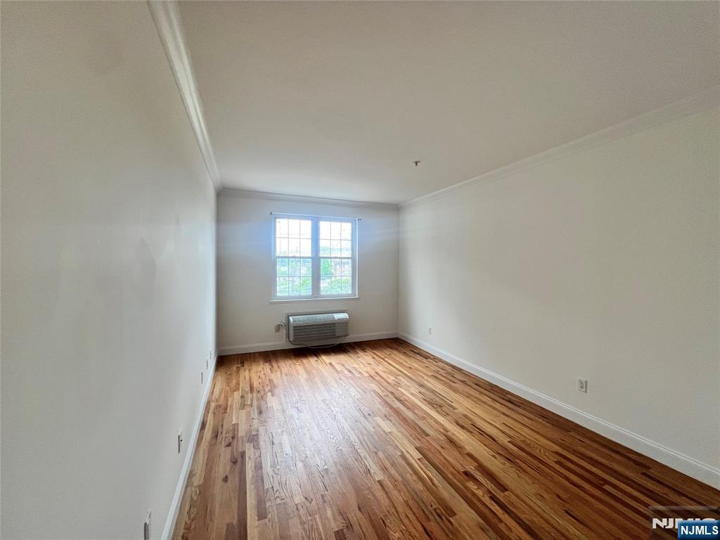 1100 River Road, Unit 206 Edgewater, NJ 07020 - Photo 11 of 13 a view of a room with wooden floor and windows
