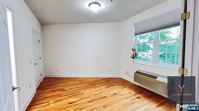 a view of an empty room and window