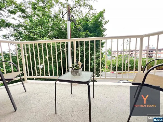 a view of a chairs and tables in the balcony