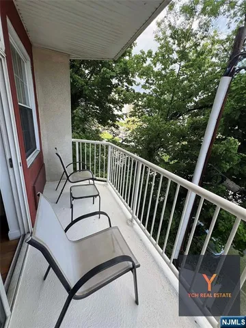 a view of balcony with furniture