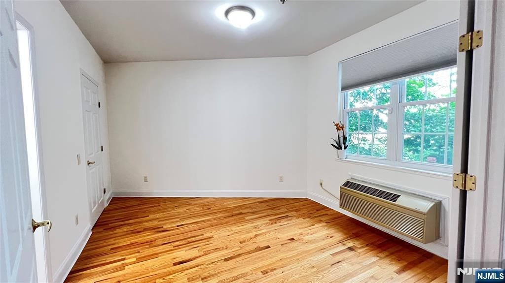 1100 River Road, Unit 206 Edgewater, NJ 07020 - Photo 7 of 13 a view of an empty room and window