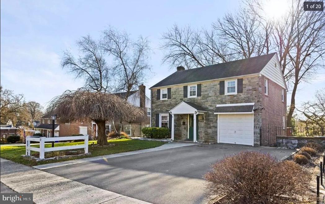 64 Warrior Road Drexel Hill, PA 19026 - Photo 1 of 11 a front view of house with yard and trees around