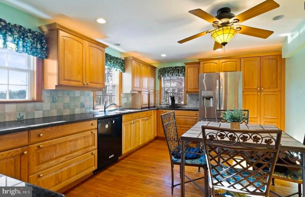 64 Warrior Road Drexel Hill, PA 19026 - Photo 3 of 11 a kitchen with stainless steel appliances granite countertop a stove and a sink