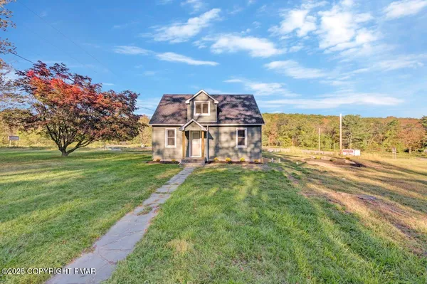 a view of a house with a big yard