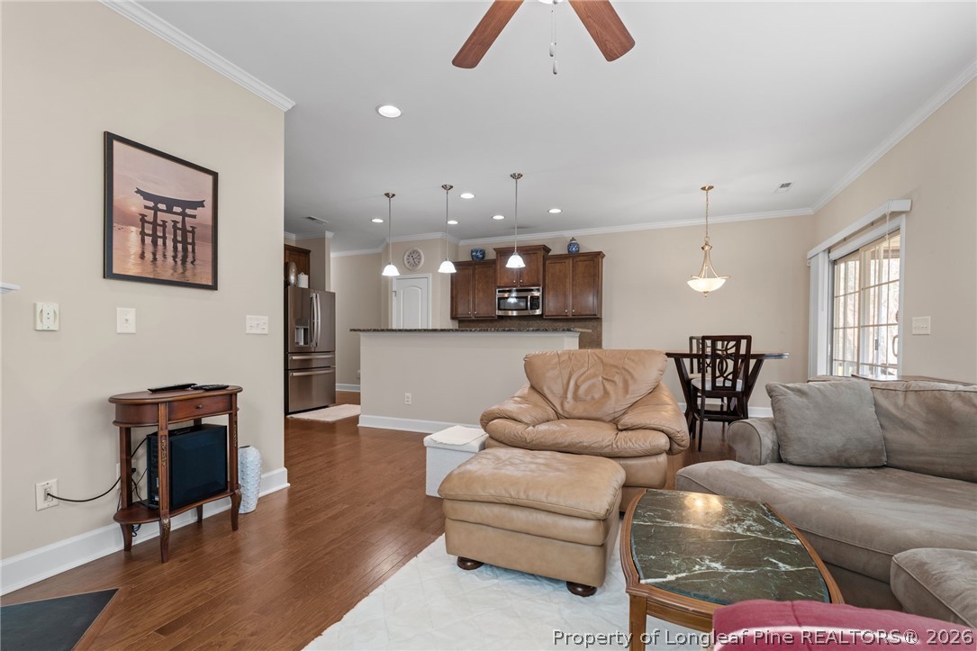 126 Pine Hawk Drive Spring Lake, NC 28390 - Photo 12 of 48 a living room with furniture and kitchen view