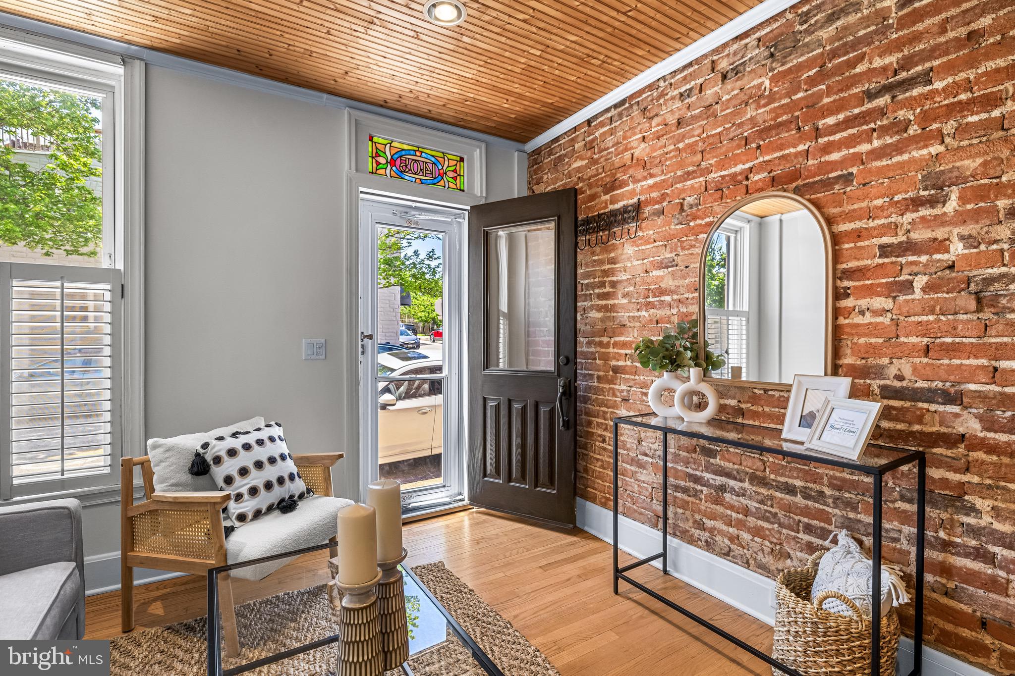 1405 Covington Street Baltimore, MD 21230 - Photo 2 of 26 Exposed brick & gleaming hardwood floors!