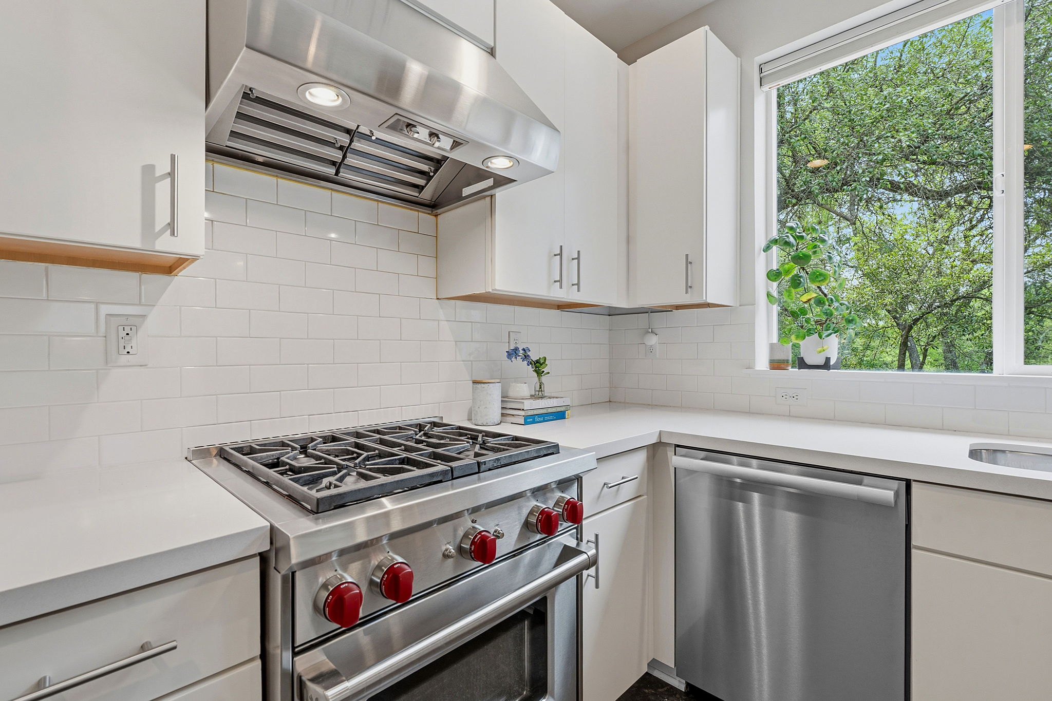 3001 Del Curto Road, Unit 31 Austin, TX 78704 - Photo 7 of 32 a kitchen with stainless steel appliances cabinets and a window