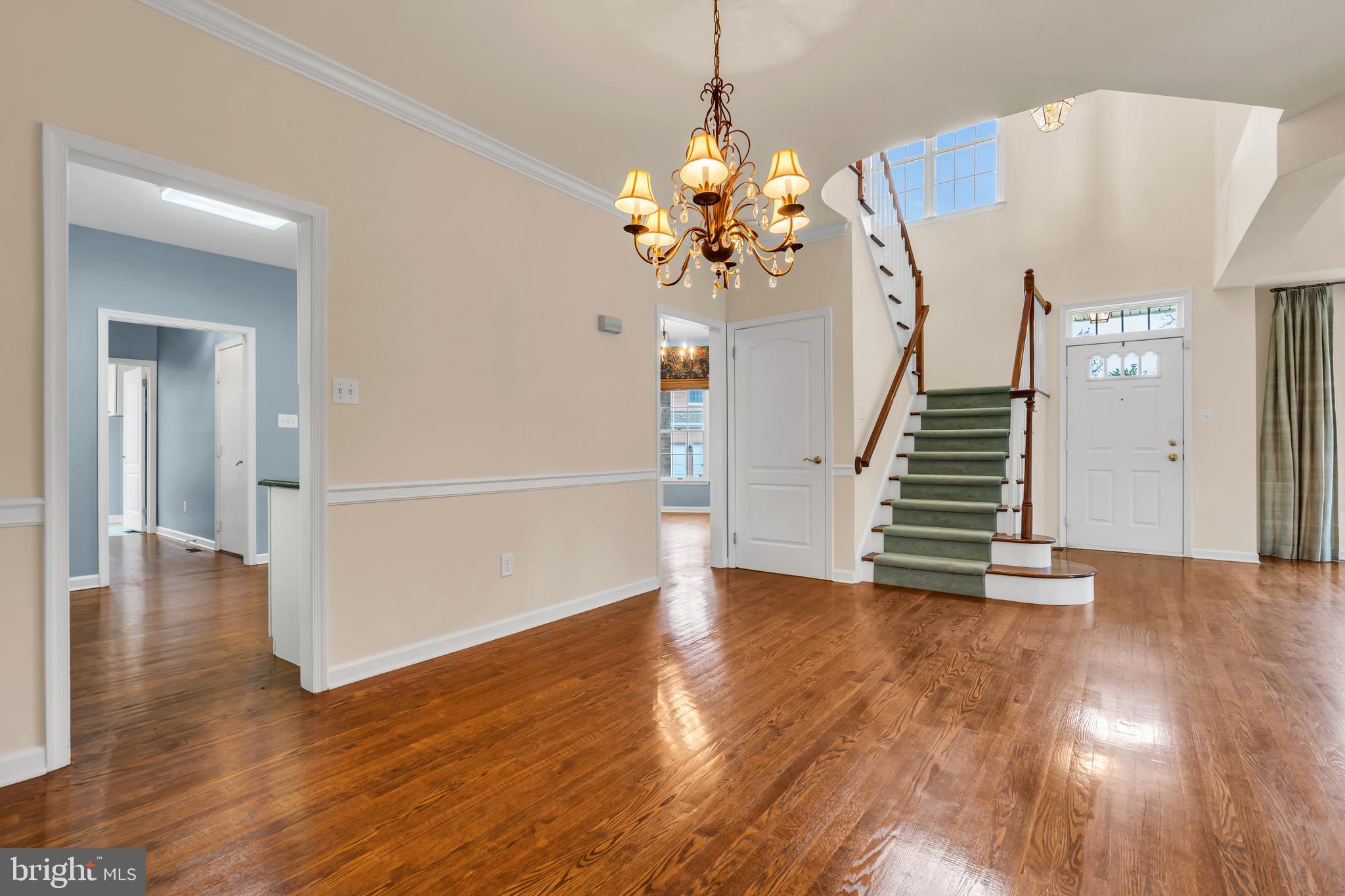 21 Wilkinson Way Princeton, NJ 08540 - Photo 15 of 43 a view of a livingroom with wooden floor and stairs