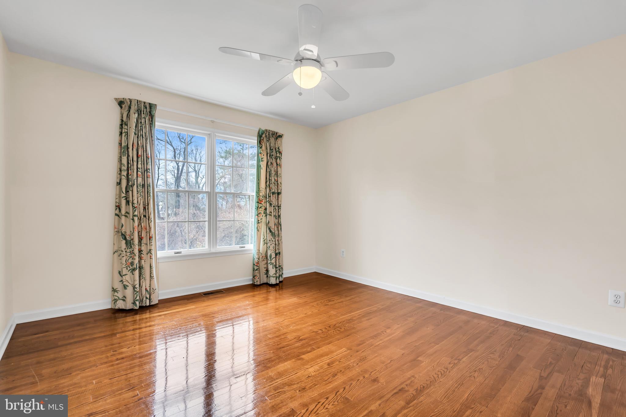 21 Wilkinson Way Princeton, NJ 08540 - Photo 32 of 43 an empty room with wooden floor and windows