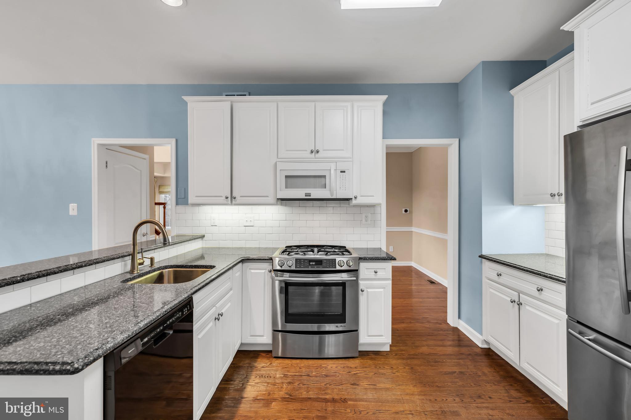 21 Wilkinson Way Princeton, NJ 08540 - Photo 8 of 43 a kitchen with a sink stove and refrigerator