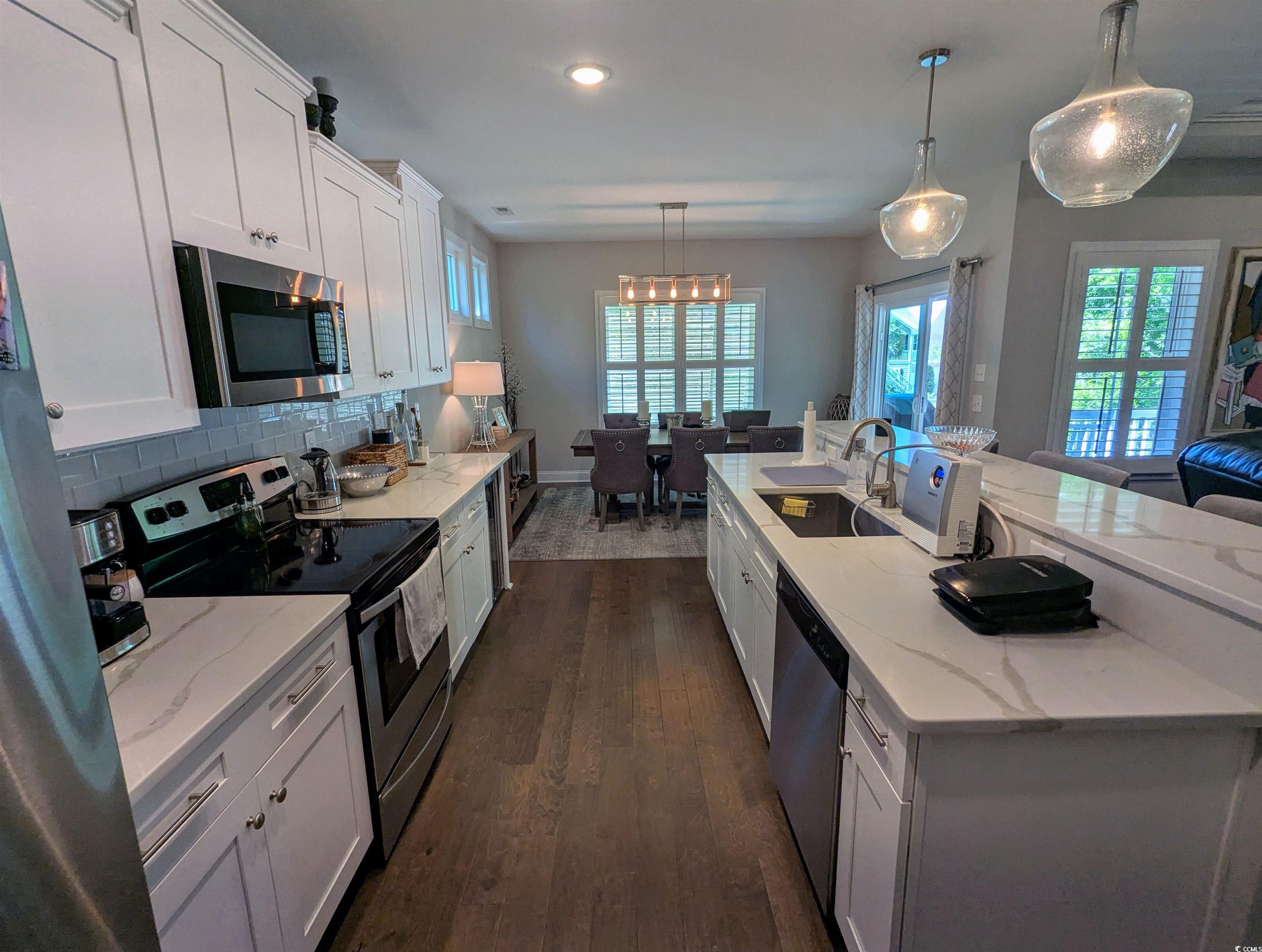 18 Trigger Fish Lane Murrells Inlet, SC 29576 - Photo 14 of 31 Kitchen featuring a sink, dark wood-type flooring,