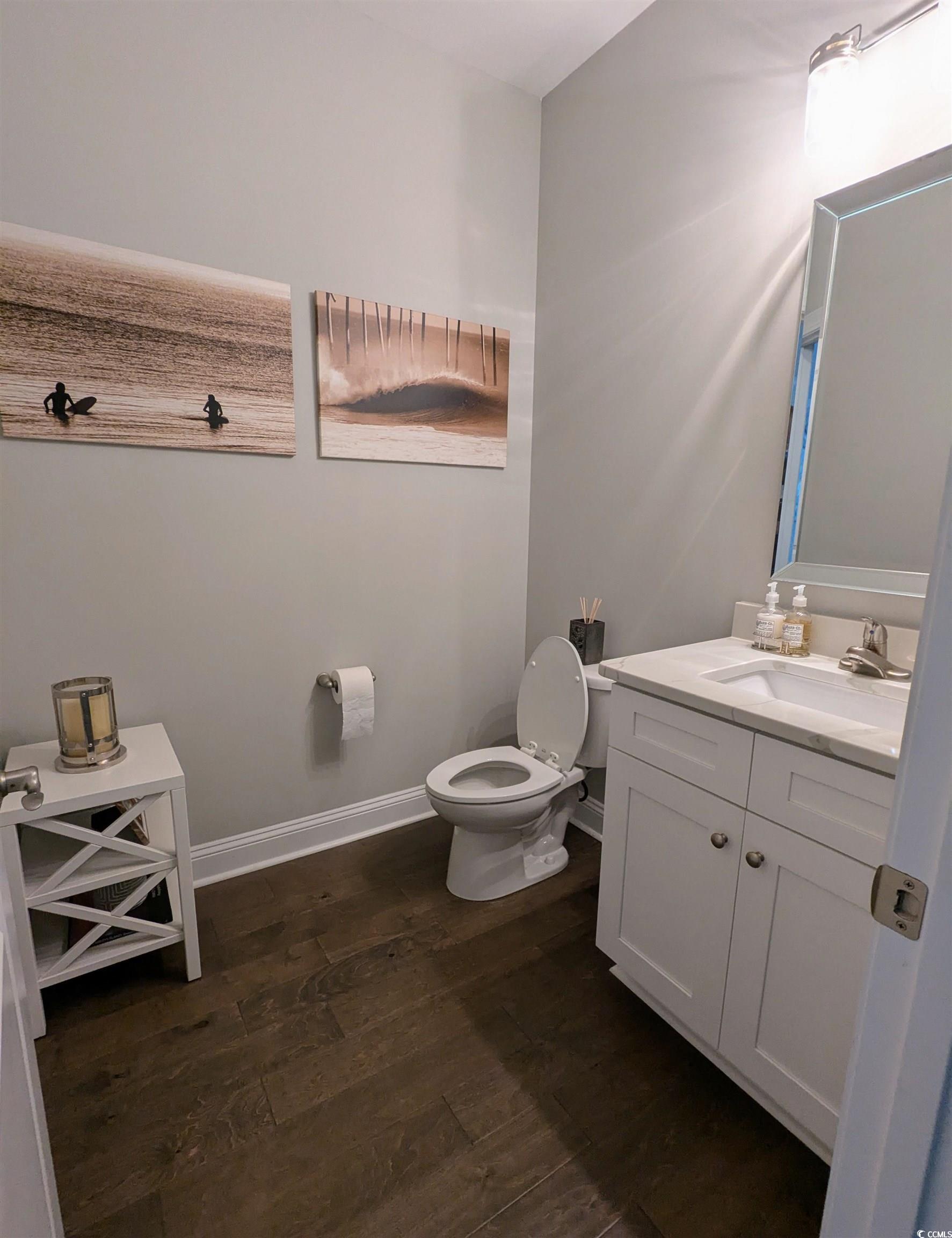 18 Trigger Fish Lane Murrells Inlet, SC 29576 - Photo 16 of 31 Half bath featuring wood finished floors, toilet,