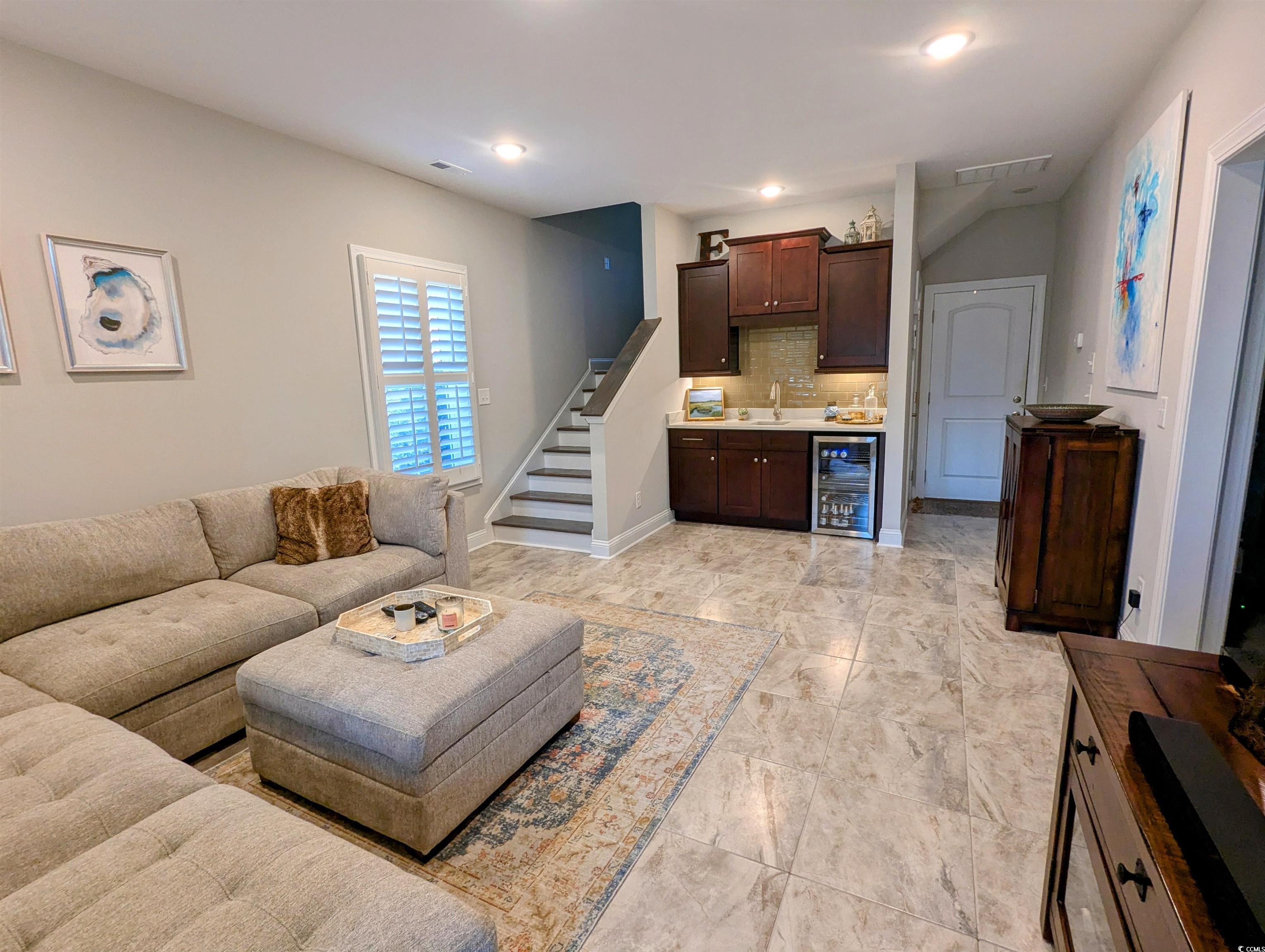 18 Trigger Fish Lane Murrells Inlet, SC 29576 - Photo 20 of 31 Living room featuring bar, visible vents, wine coo