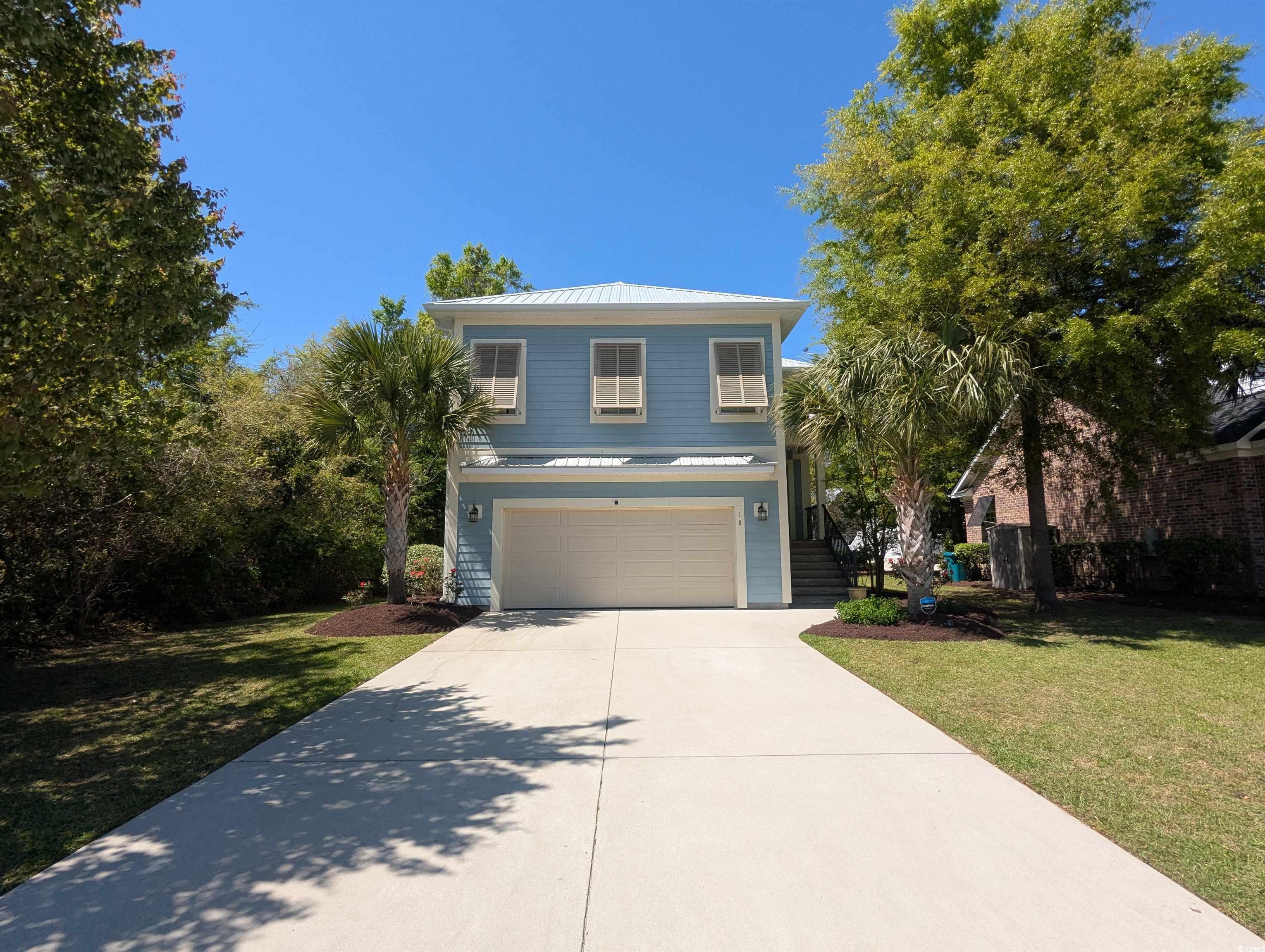 18 Trigger Fish Lane Murrells Inlet, SC 29576 - Photo 2 of 31 Traditional-style house with a front lawn, a stand