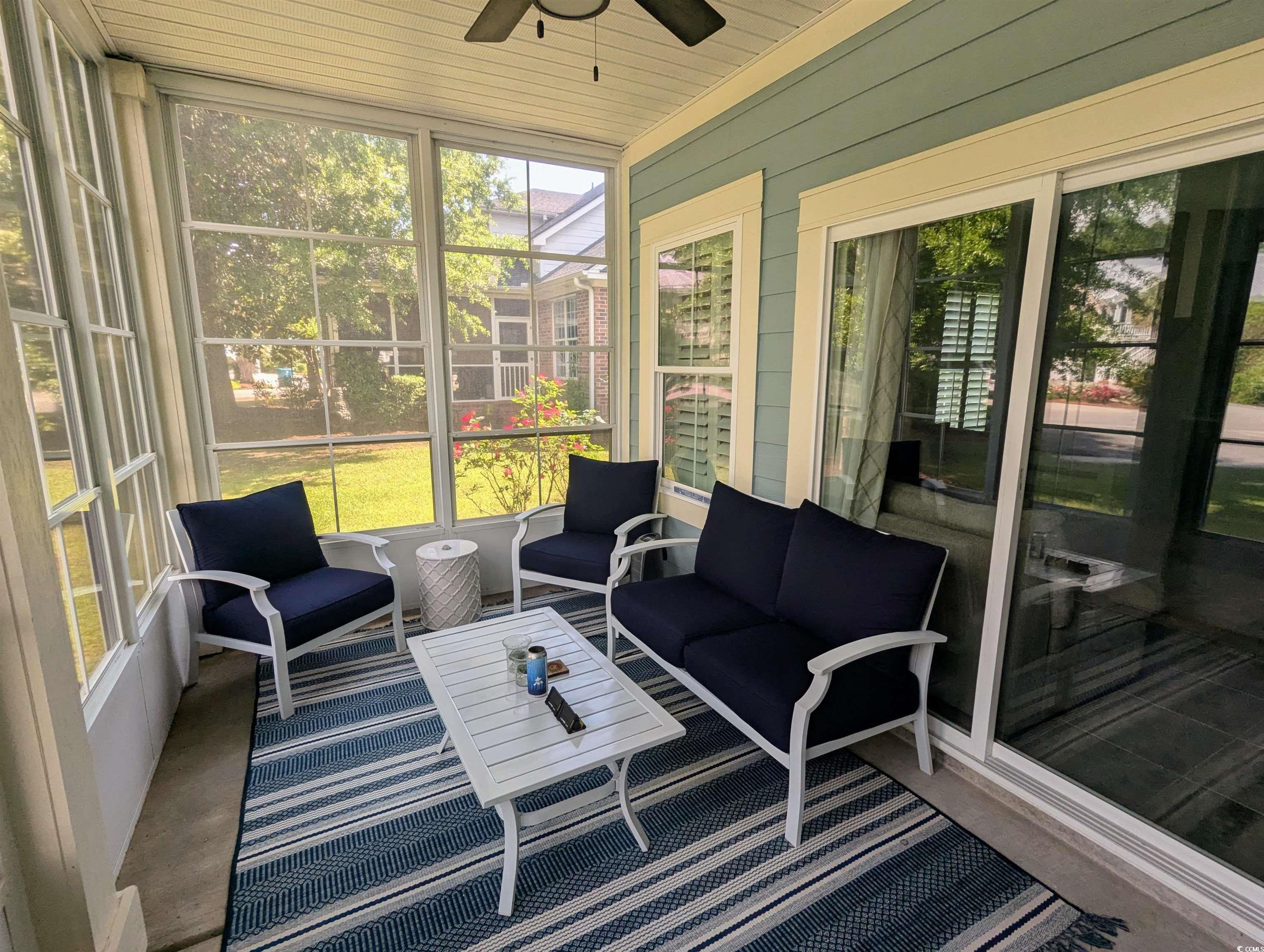 18 Trigger Fish Lane Murrells Inlet, SC 29576 - Photo 24 of 31 Sunroom with a ceiling fan and an outdoor living s