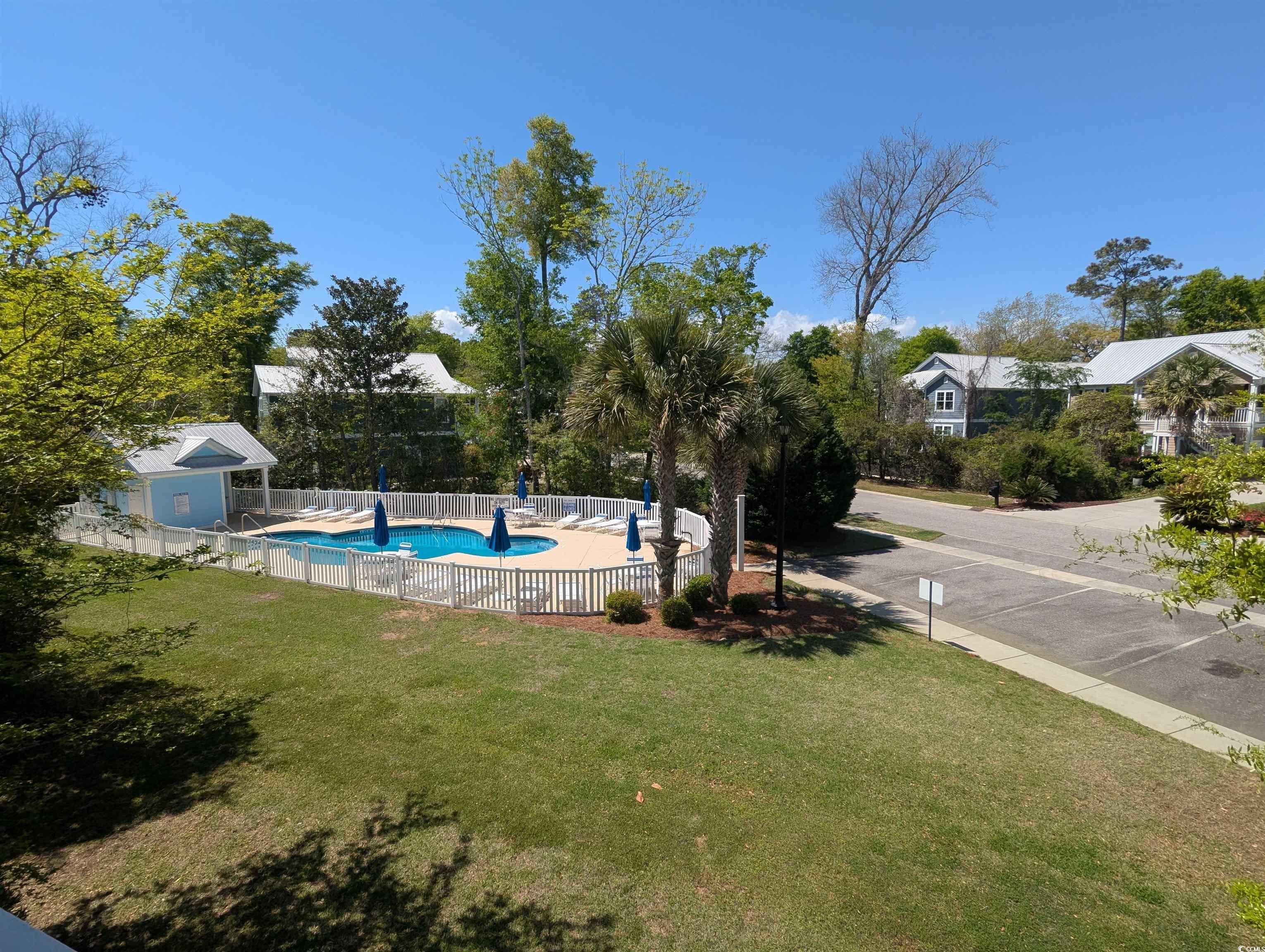 18 Trigger Fish Lane Murrells Inlet, SC 29576 - Photo 26 of 31 View of swimming pool featuring a yard, a fenced i