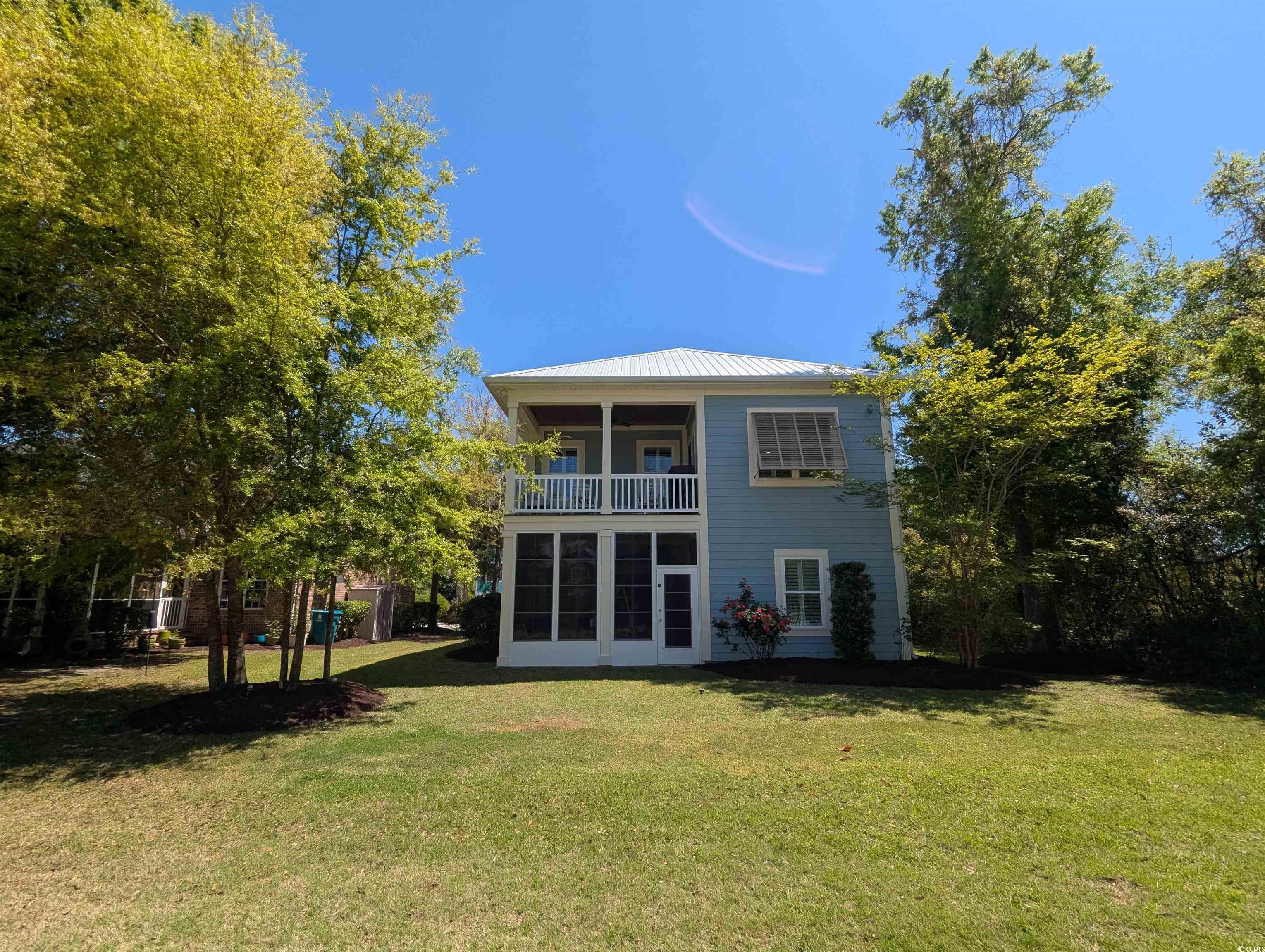 18 Trigger Fish Lane Murrells Inlet, SC 29576 - Photo 6 of 31 Back of house with a lawn, a balcony, and metal ro