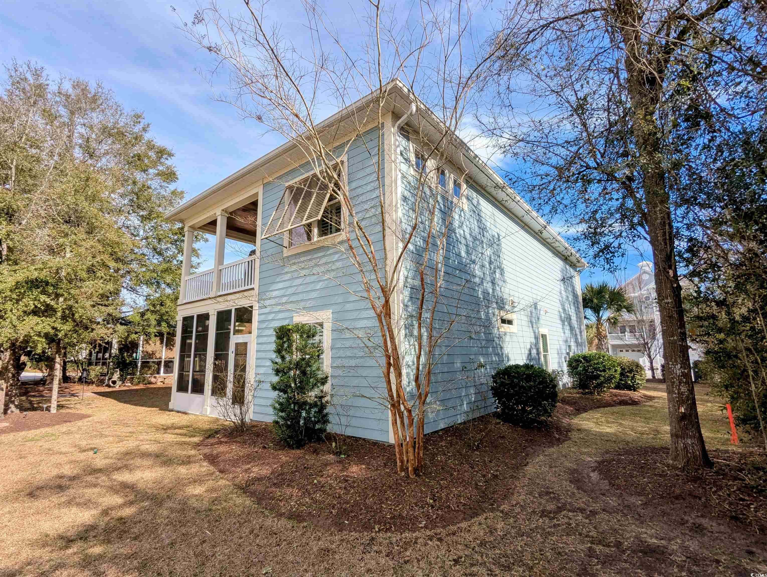 18 Trigger Fish Lane Murrells Inlet, SC 29576 - Photo 8 of 31 View of property exterior featuring a sunroom and