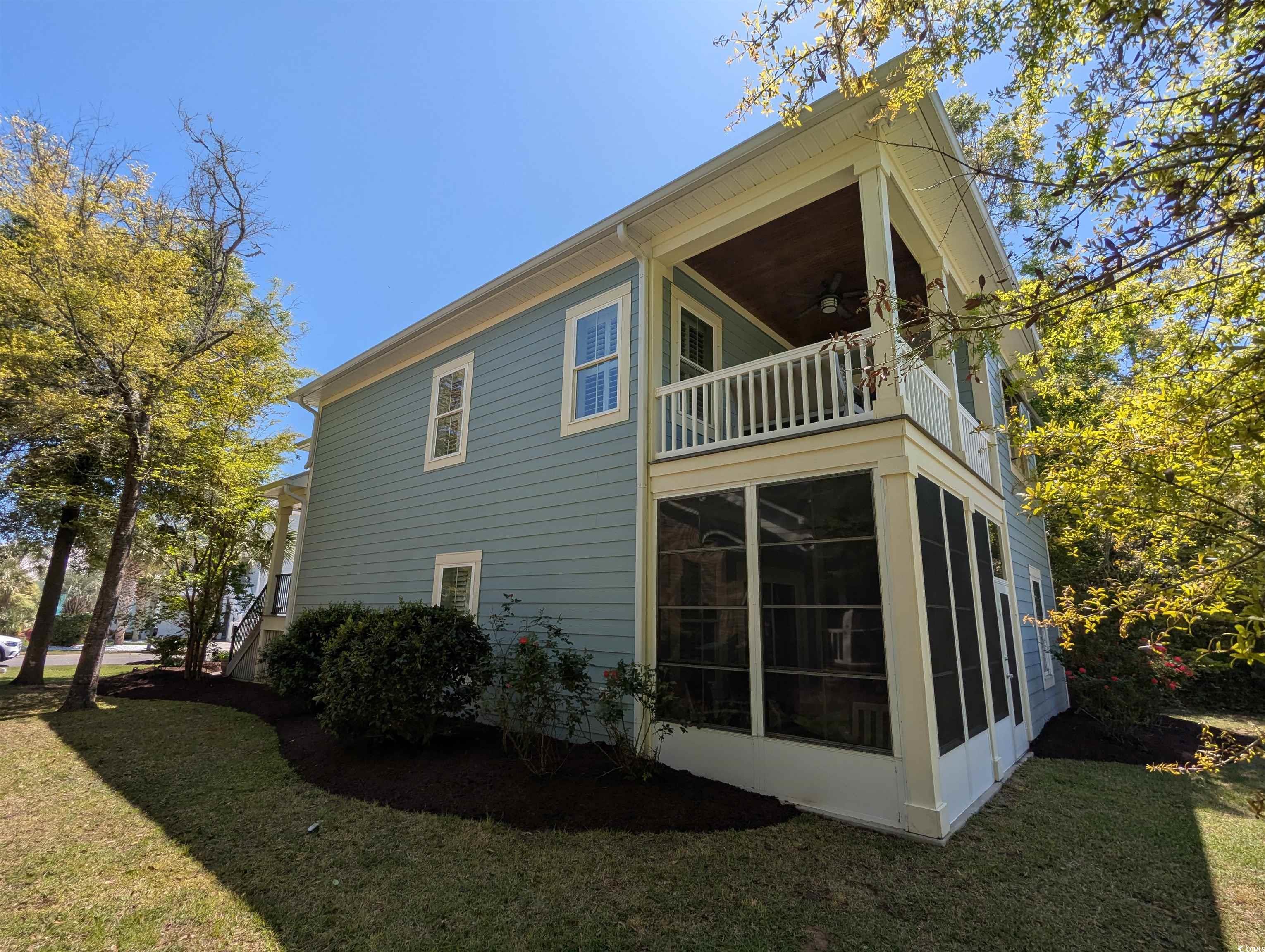 18 Trigger Fish Lane Murrells Inlet, SC 29576 - Photo 9 of 31 View of side of property featuring a yard, a ceili