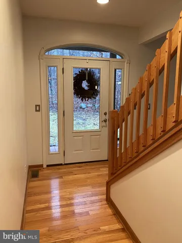 a view of entryway with wooden floor