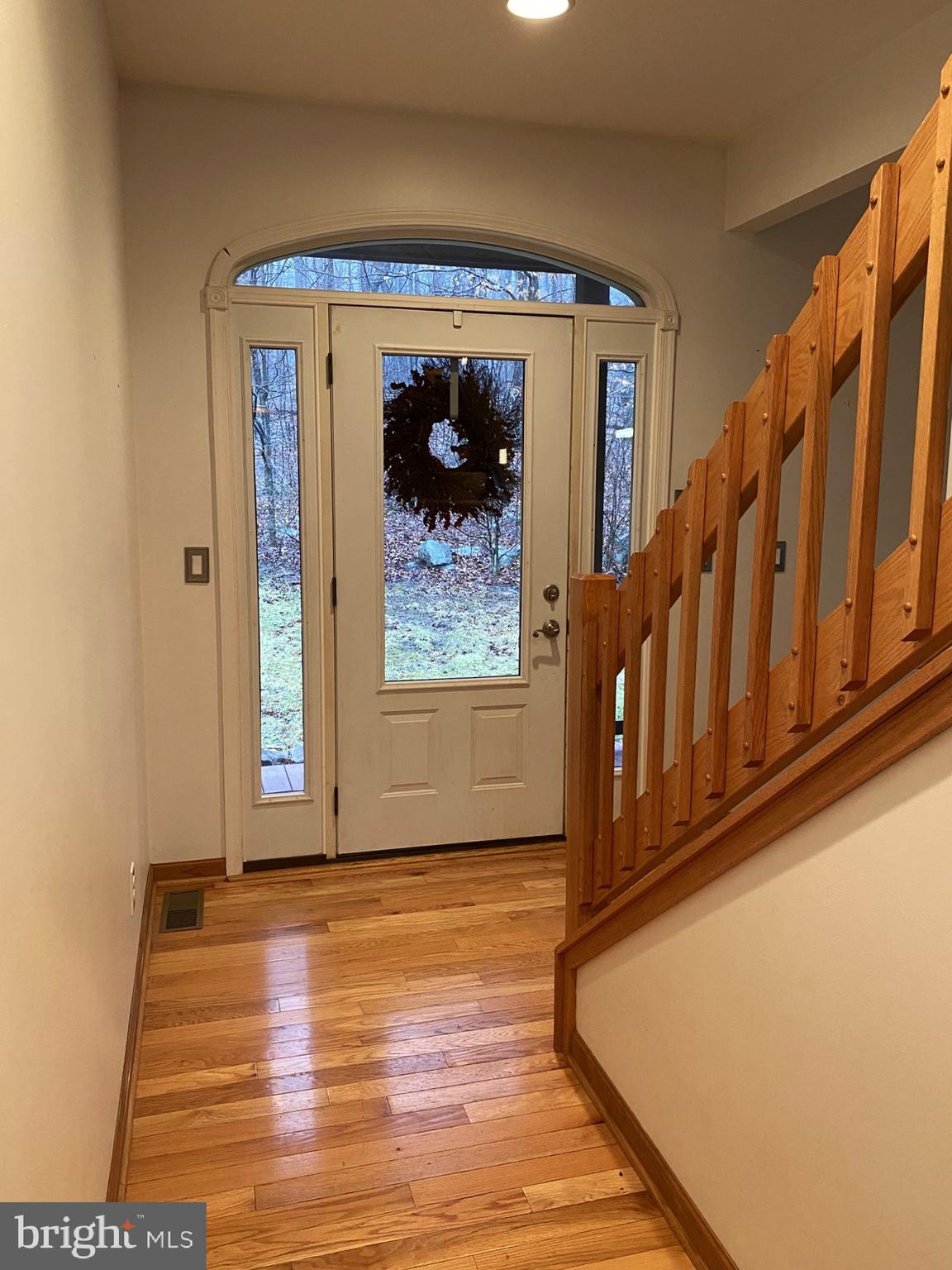 10915 Rachael Avenue Midlothian, MD 21543 - Photo 11 of 52 a view of entryway with wooden floor