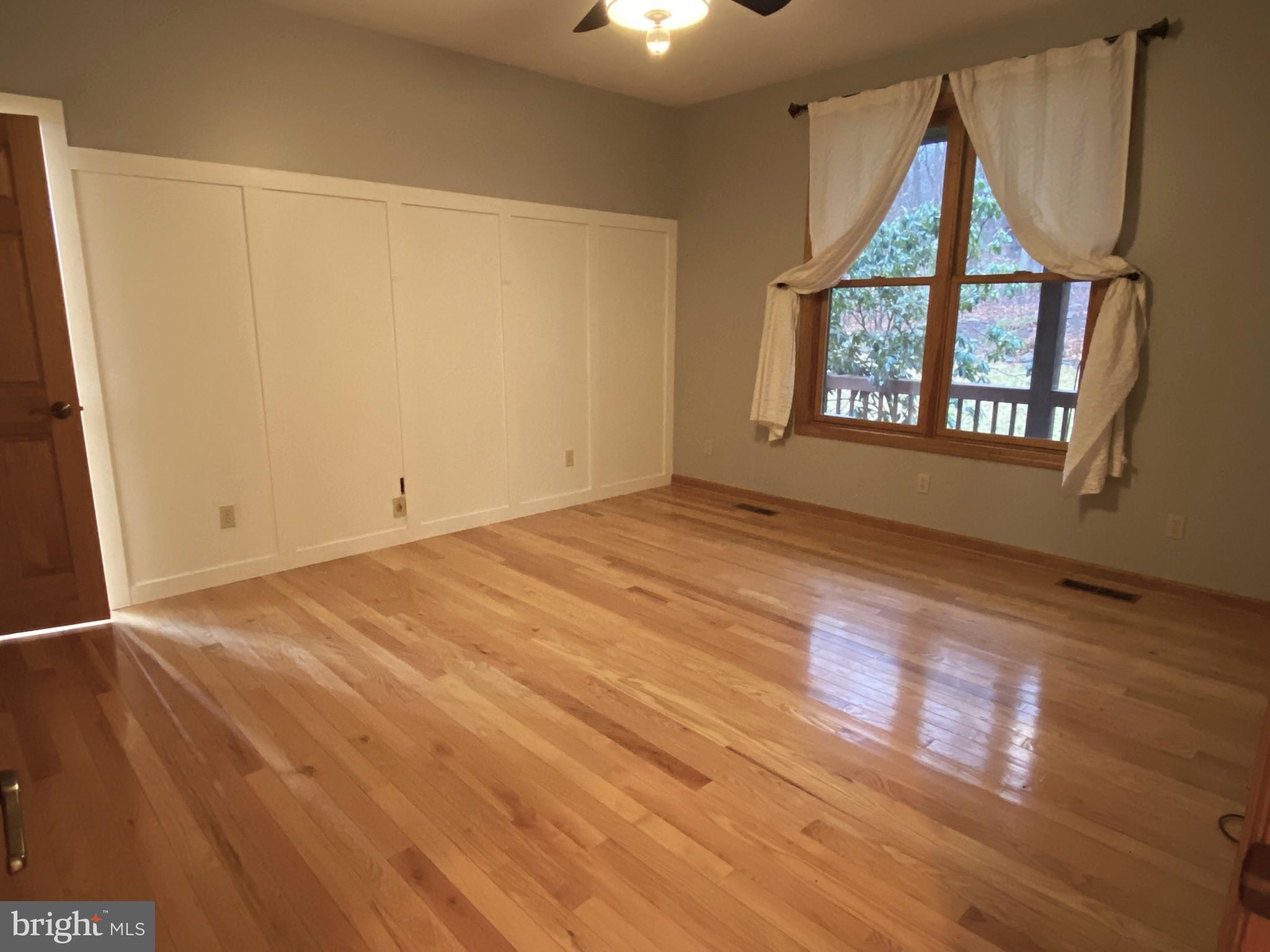 10915 Rachael Avenue Midlothian, MD 21543 - Photo 12 of 52 wooden floor in an empty room with a window