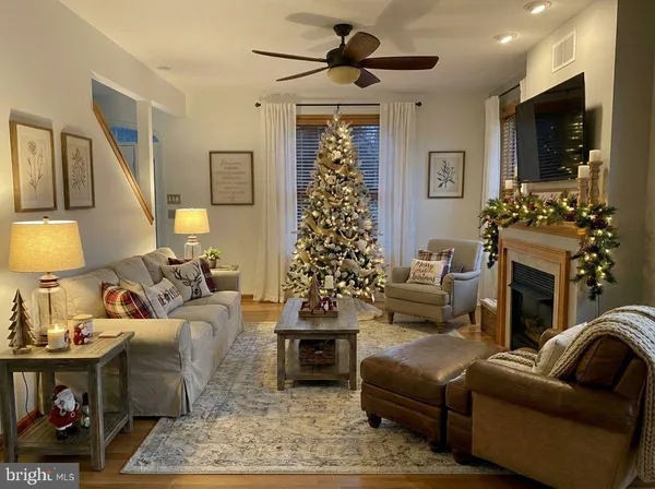 a living room with furniture and a rug