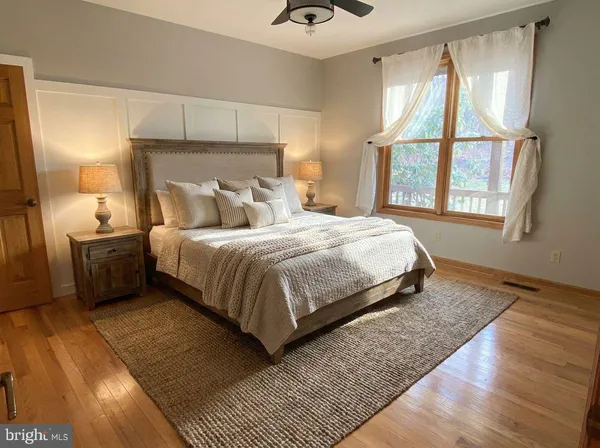 a view of an empty room and wooden floor