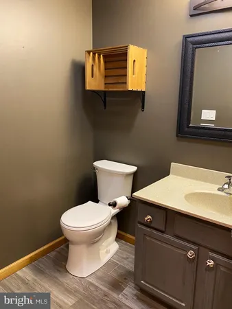 a kitchen with granite countertop a stove and cabinets