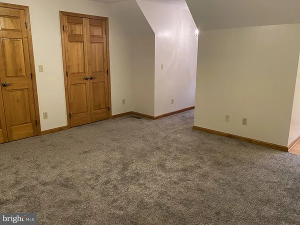 an empty room with a mirror